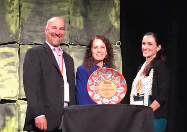 RALIANCE’s David Lee and CDC’s Kathleen Basile with Award winner Cynthia Fraga-Rizo