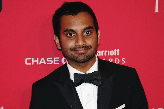 Aziz Ansari wearing a tuxedo at a red carpet event