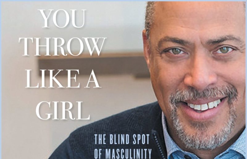 Cover of book You Throw LIke a Girl: The Blind Side of Masculnity with pciture of authro Don MsPherson, African AMerican man with beared wearing blue shirt and darker blue sweater