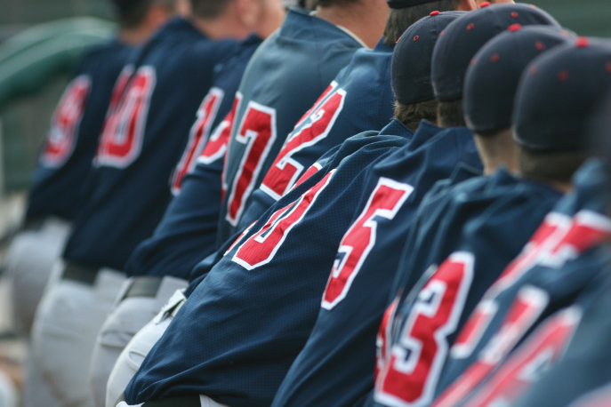 Baseball teammates sitting on a bench