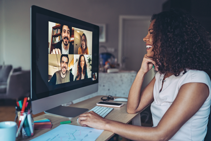 Woman talking on a video conference with her coworkers