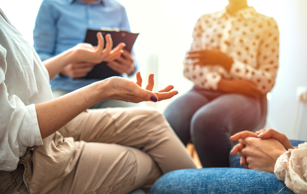 People sitting in a circle talking