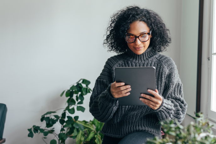 Woman reading on her tablet