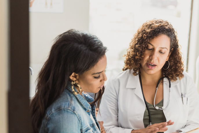 Woman speaking with doctor