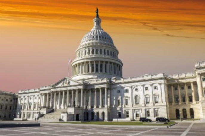 United States Capitol building in front of yellow sky