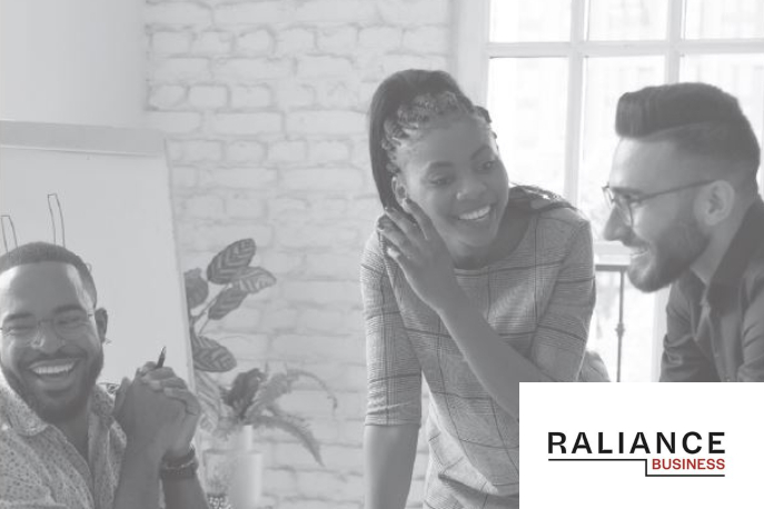 Black and white photo of two young men and one young woman laughing with Raliance logo in right corner.