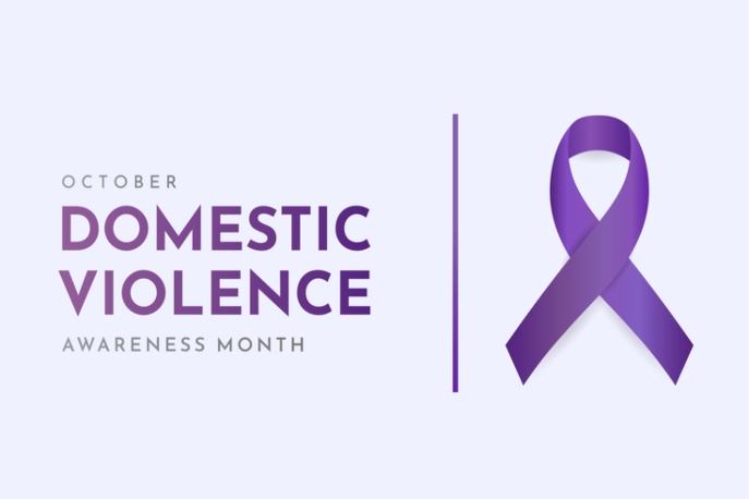 Light purple graphic that says, "October Domestic Violence Awareness Month" with a purple ribbon