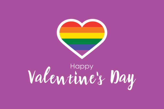 Rainbow heart with white text underneath that says "Happy Valentine's Day". Purple background.