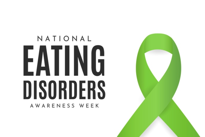 "National Eating Disorders Awareness Week" in black text on white background, next to a green ribbon.