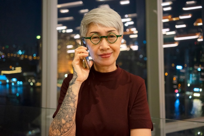 Chinese business woman with an arm tattoo