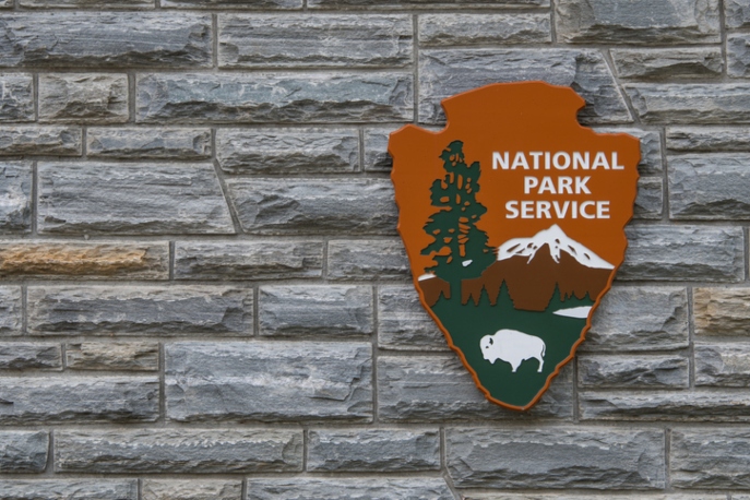 National Park Service sign on grey brick wall