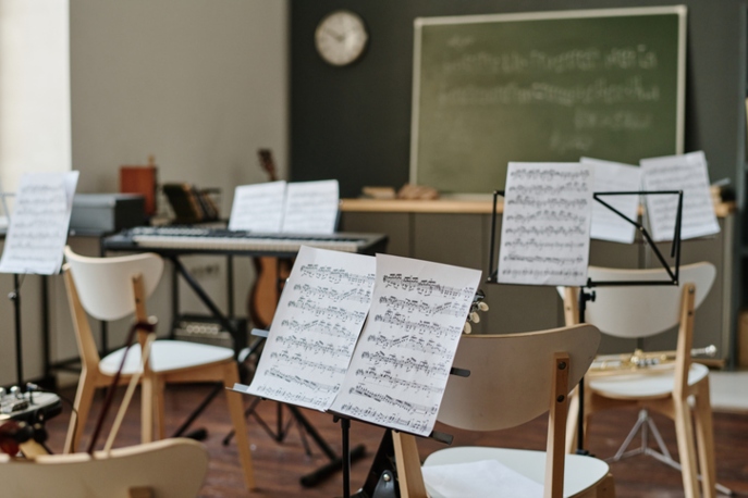 Sheet music on music stands in modern classroom