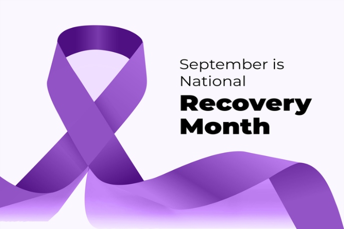 "September is National Recovery Month" Black text, white background, purple ribbon