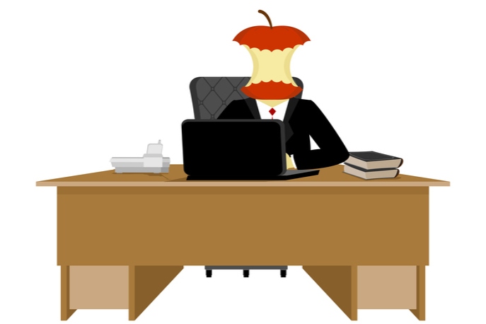 Boss behind a desk with an apple core as a head.